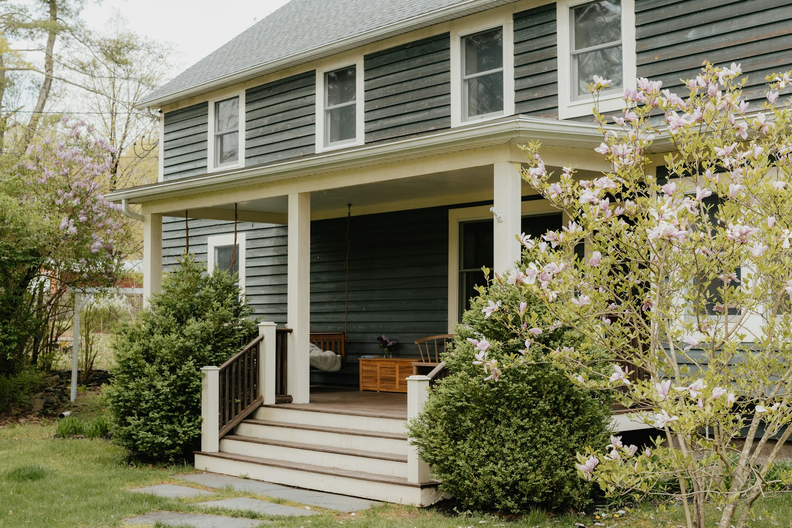 A house with a porch and steps to the front door